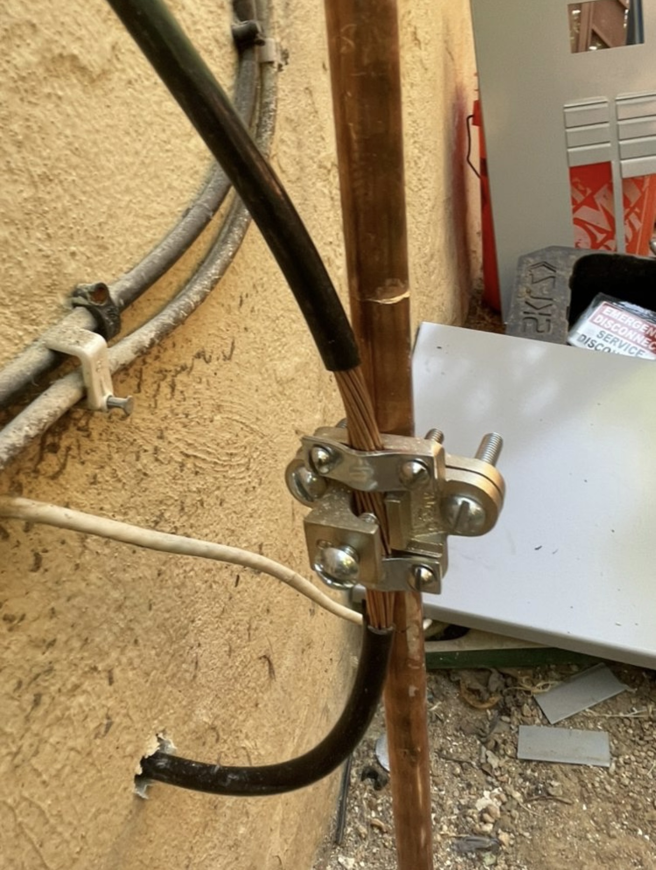Copper grounding rod and clamp installation