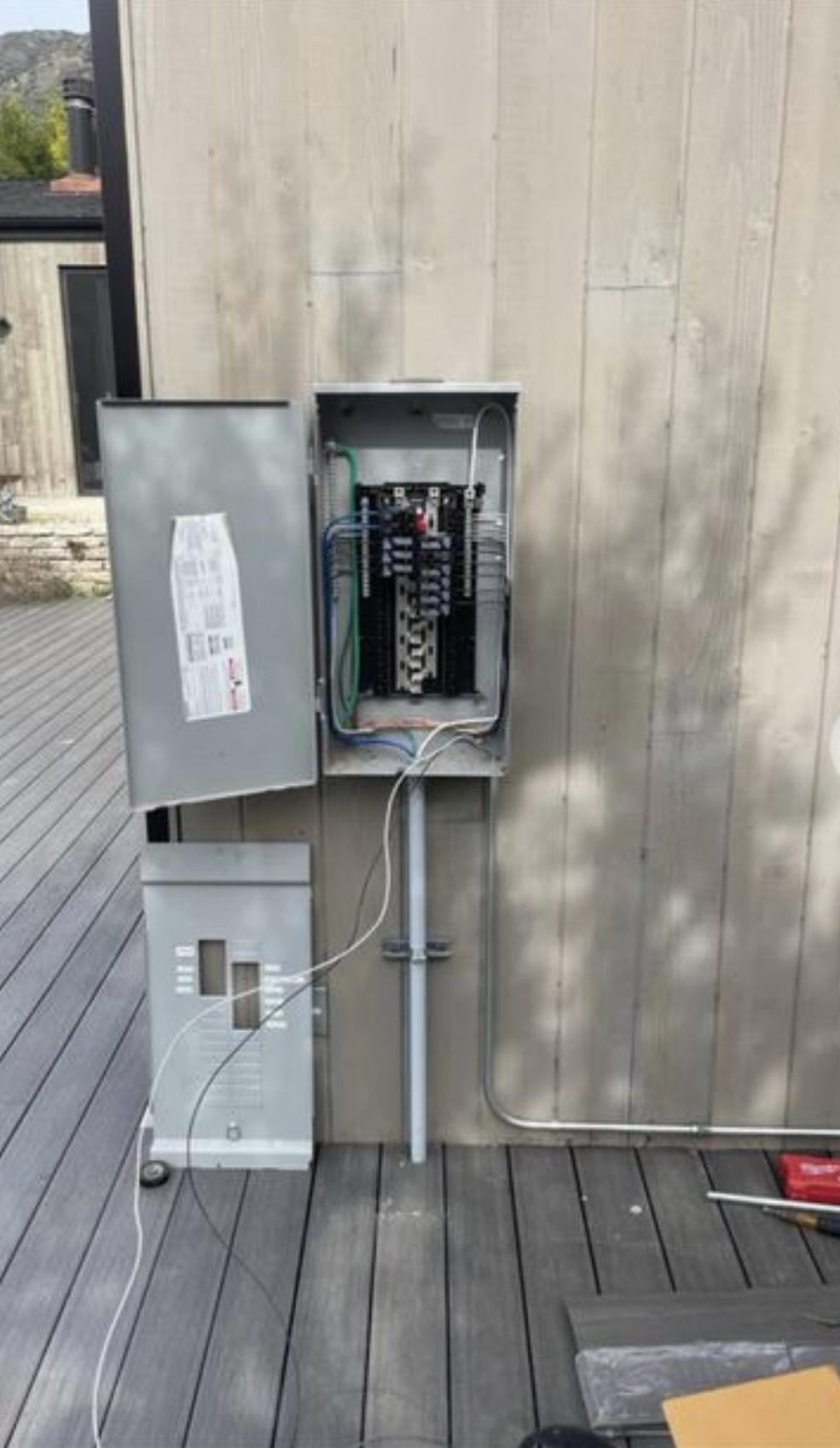 Exterior main panel with sub-panel installation